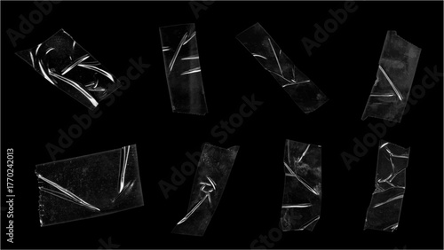 Set of Wrinkled Transparent Plastic Packaging Tape Strips with Air Bubbles Isolated on a Dark Black Background for Grunge Overlay
