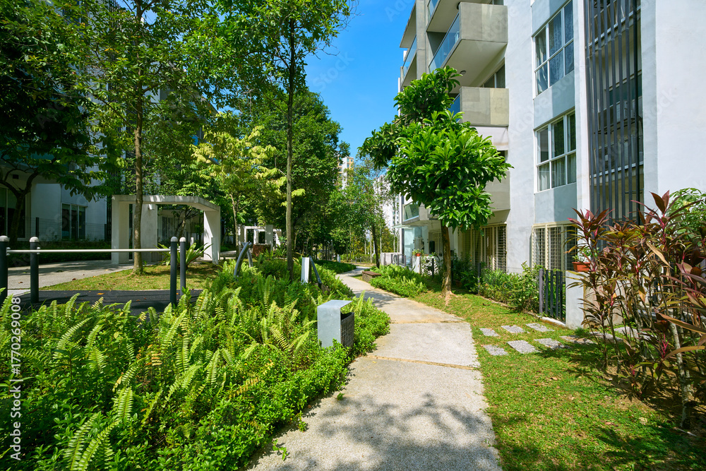 Naklejka premium Modern apartment buildings with green park and outdoor exercise area