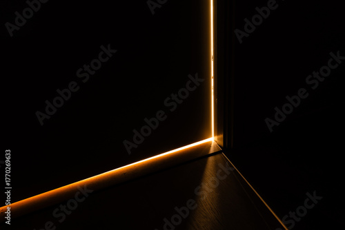 Photos Stockholm, Sweden A residential apartment door is ajar at night.