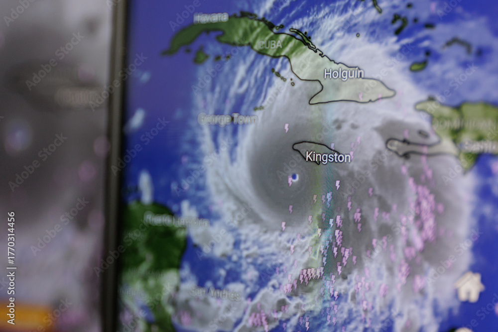 Fototapeta premium Hurricane Melissa shown on screen through windy app. Catastrophic storm towards Jamaica