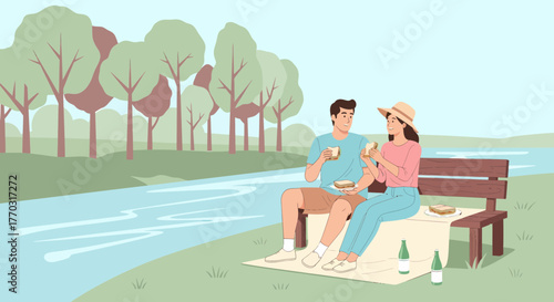 Couple Enjoying Picnic By The River On A Sunny Day