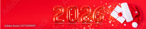 banner, red inflatable balloons shaped as the numbers 2026 on a red background with place for text