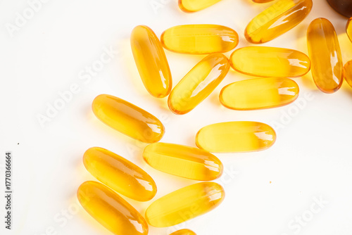 Fish oil or Cod liver oil gel in capsules with omega 3 vitamins, supplementary healthy food.