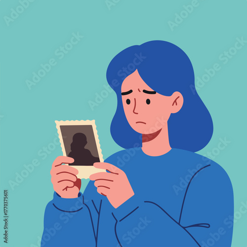 An illustration shows a person with blue hair and a sad expression holding a vintage photo