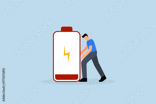 Exhausted and fatigue from hard work, weary and exhausted entrepreneur poses with low battery indicator