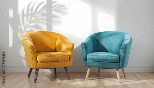 Two armchairs, one yellow and one blue, are placed in a room with sunlight coming through the window