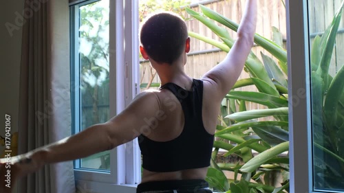 Beautiful Woman Dancing Gracefully in Sunlight with Lens Flares