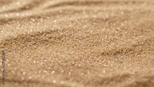Mesmerizing abstract patterns of dry sand shifting and flowing in a gentle, dynamic motion element, artistic, mesmerizing