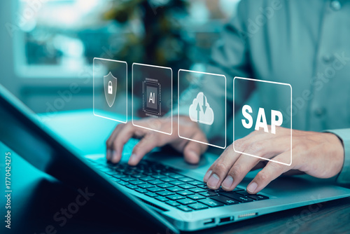 businessman working on computer with icons of SAP - Business process automation software. ERP enterprise resources planning system concept.Program helps manage business to access information.