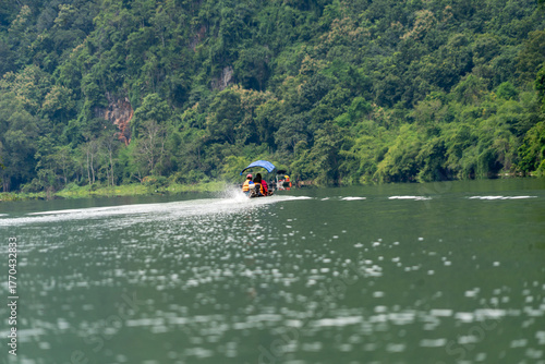 A boat with a person in it is on a lake