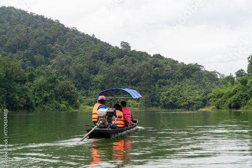 A boat with a blue canopy and a red canopy