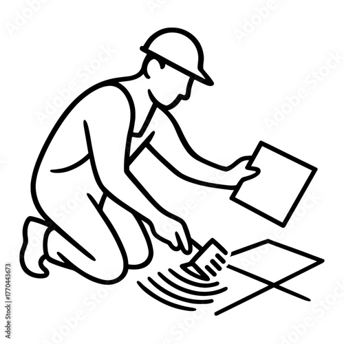 Construction worker applying adhesive while laying tiles on floor  