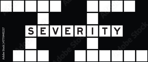 Alphabet letter in word severity on crossword puzzle background