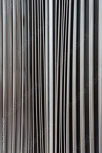 Photos An abstract, close-up shot of the vertical folds and pleats of the accordion joi