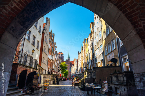 Gdansk's Mariacka Street showcases its iconic architecture, cobblestone paths, and vibrant facades. Elements of history and culture are captured in this picturesque urban scene