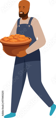 Smiling farmer walking and carrying a basket full of freshly harvested sweet potatoes