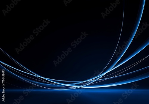 Abstract blue light trails on a dark background, creating a dynamic and modern design.