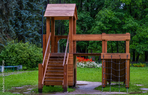 Children's slide made of wood on the playground.