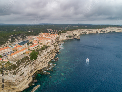 Aerial view marina cape Bonifacio south Corsica France citadel on rocky promontory on wild white limestone cliffs