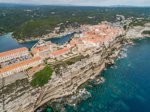 Aerial view marina cape Bonifacio south Corsica France citadel on rocky promontory on wild white limestone cliffs