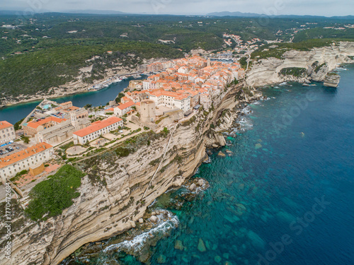 Aerial view marina cape Bonifacio south Corsica France citadel on rocky promontory on wild white limestone cliffs