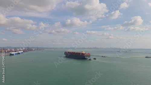 Aerial view of a large cargo container ship approaching Laem Chabang Port in Chonburi, Thailand