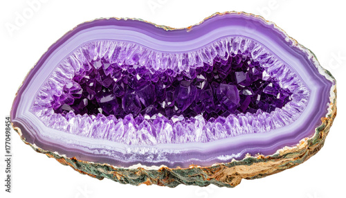 Purple agate slice with crystal-filled geode. Close-up shot reveals intricate mineral formations and varied color textures