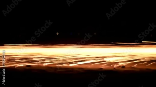 Sparks flying on black background.