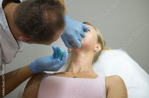 doctor gives beauty injections to a woman