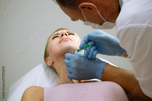 doctor gives beauty injections to a woman