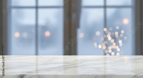 Empty marble top table with blurred winter window background and bokeh lights