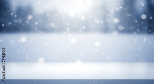 Snowy winter background with blurred forest and falling snowflakes backdrop
