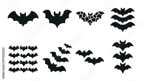 Silhouettes of various bat shapes on dark background for halloween