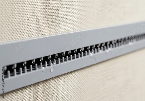 Macro shot of a fabric partition's self-cleaning nozzle system