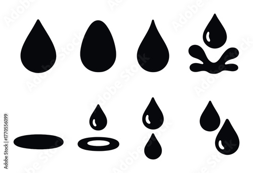 Black water droplets and splashes on dark background