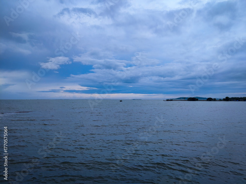 selective focus picture of sea in the stormy weather. surrounded by dark clouds and high waves