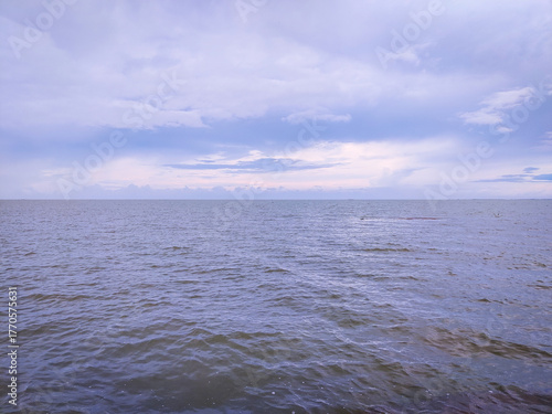 selective focus picture of sea in the stormy weather. surrounded by dark clouds and high waves