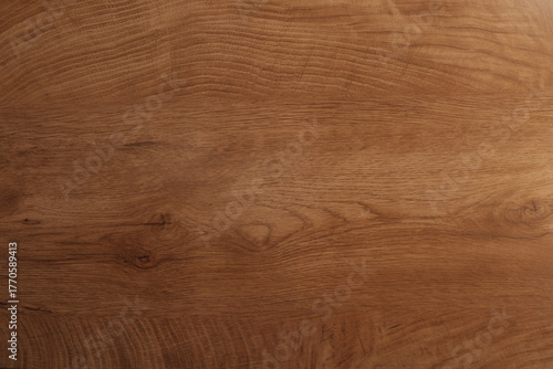 Natural wood texture background with horizontal grain and medium brown color