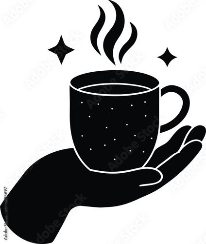 Warm coffee cup held in hand with stars and steam art