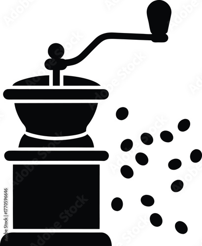 Antique manual coffee grinder grinding coffee beans into fresh grounds