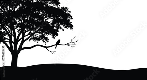 Serene silhouette of a lone tree and bird against a vibrant glowing sunset circle