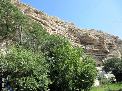 inland cliff with erosion and vegetation