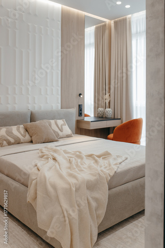 Bedroom with a bed, bedside table and lamps