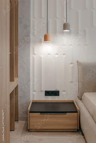 Bedroom with a bed, bedside table and lamps