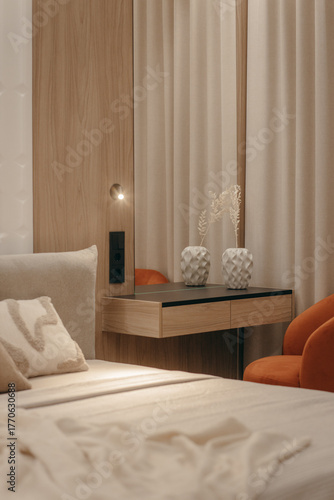 Bedroom with a bed, bedside table and lamps