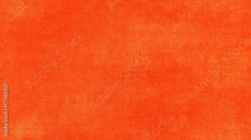 Vibrant orange background displays a subtle textured, fibrous appearance