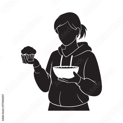 Silhouette of a person holding a cupcake and a bowl of batter