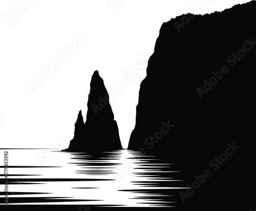 Black silhouette of towering cliffs over water landscape