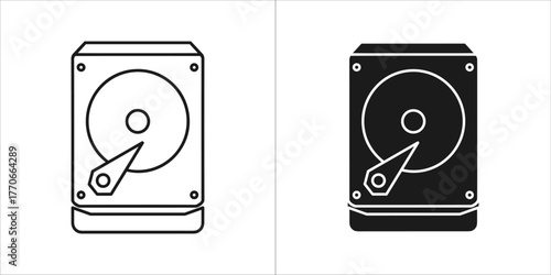 Two icons of a hard disk drive, one outlined and one solid black