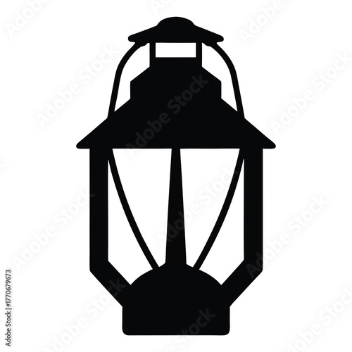 A vintage kerosene lantern silhouette casting a soft light from within